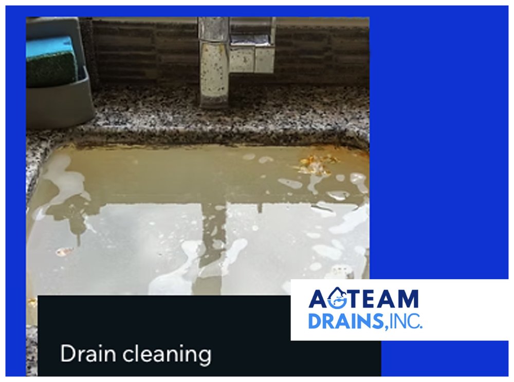 Technician cleaning a drain